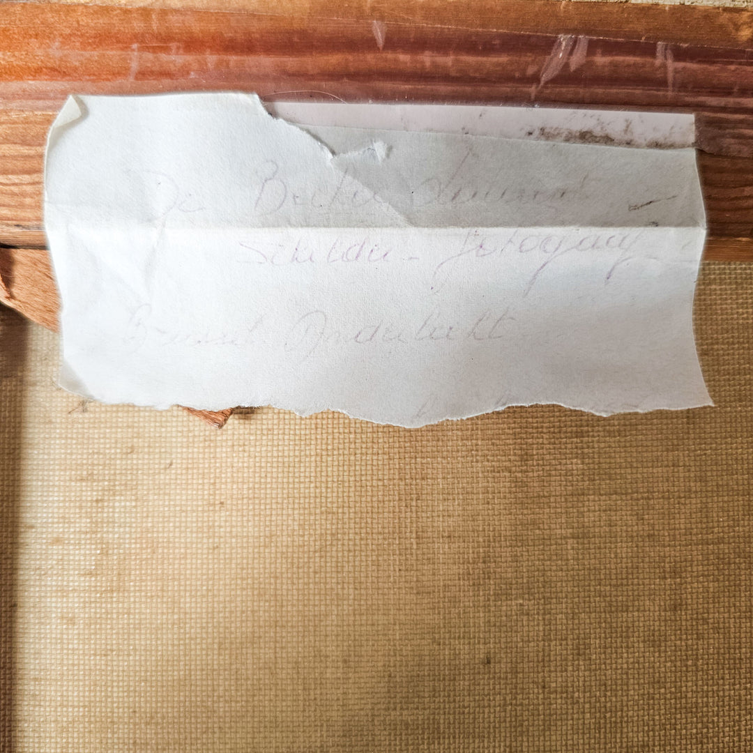 A close-up of a worn paper note on the back of a vintage painting, with partial artist name 'De Becker' and illegible text, hinting at the artwork's history.