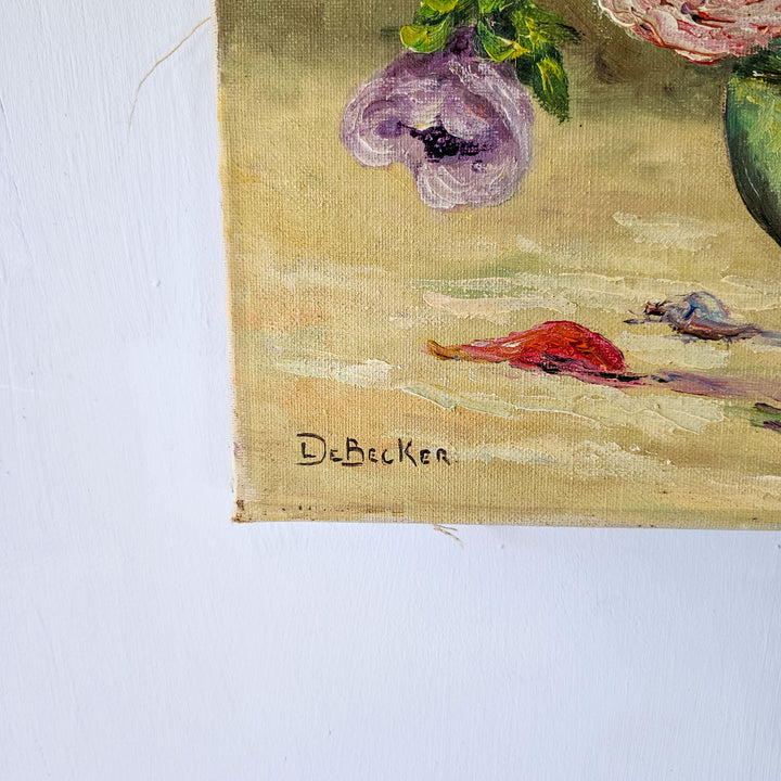 Signature of the artist De Becker in the bottom corner of a vintage floral oil painting, confirming its authenticity.