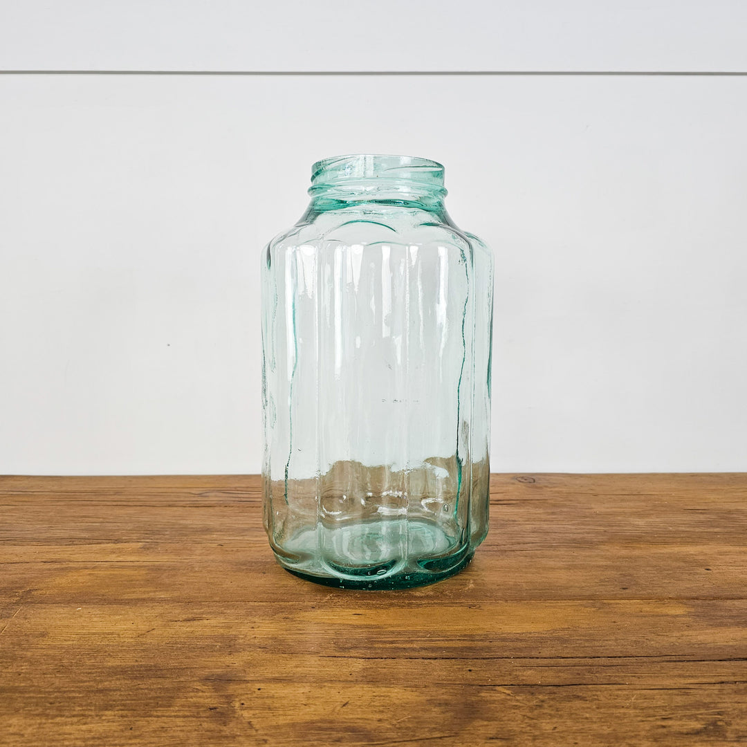 Vintage Hungarian Glass Jar: Large green glass jar with intricate bubble-like fluted design, ideal for home decor and as a decorative vase or centerpiece