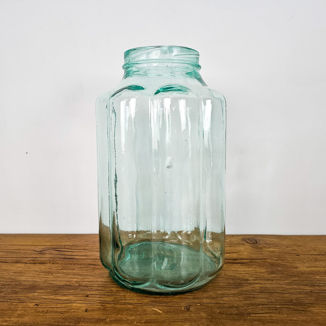 Vintage Hungarian Glass Jar: Large green glass jar with intricate bubble-like fluted design, ideal for home decor and as a decorative vase or centerpiece