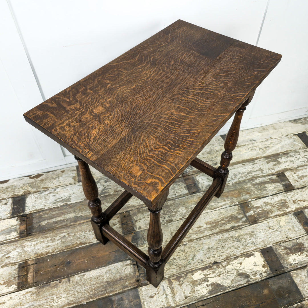 Vintage Oak End Table from the 1930s - Thick oak top with shaped apron, turned legs, and bottom stretchers