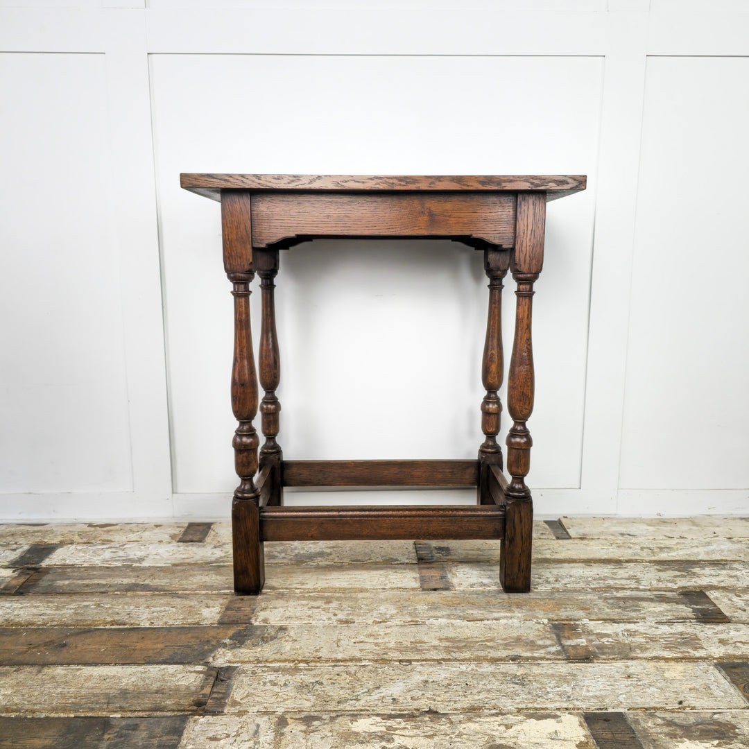 Vintage Oak End Table from the 1930s - Thick oak top with shaped apron, turned legs, and bottom stretchers