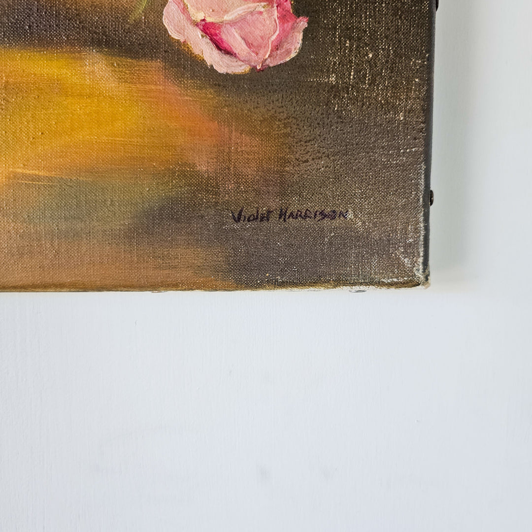 Artist's signature, Violet Harrison, in dark ink on the lower corner of a vintage oil painting, signifying authenticity and artistic ownership.