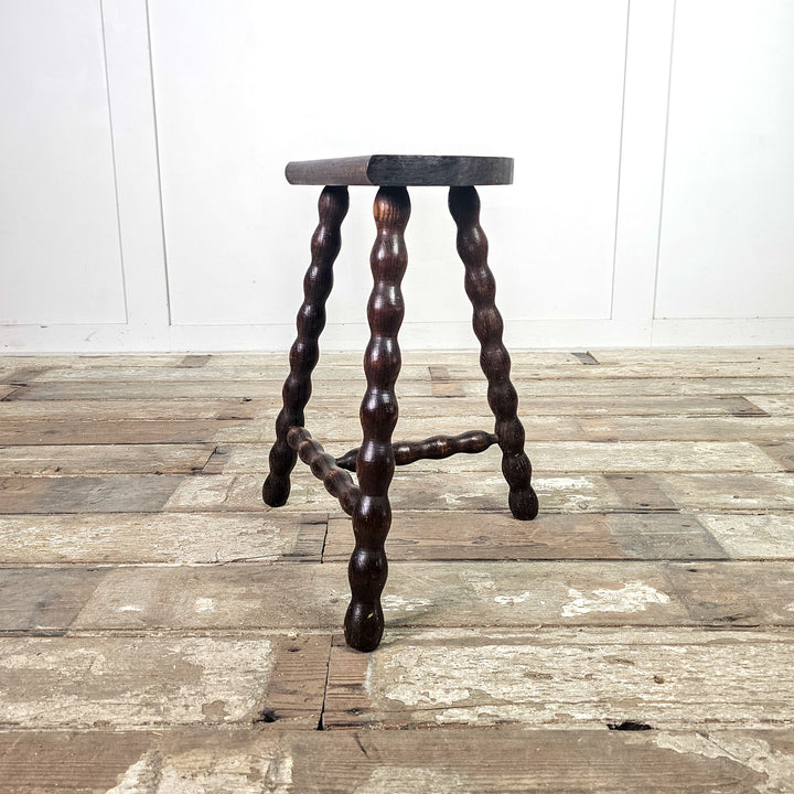 Vintage oak bobbin stool with demi-lune seat.
