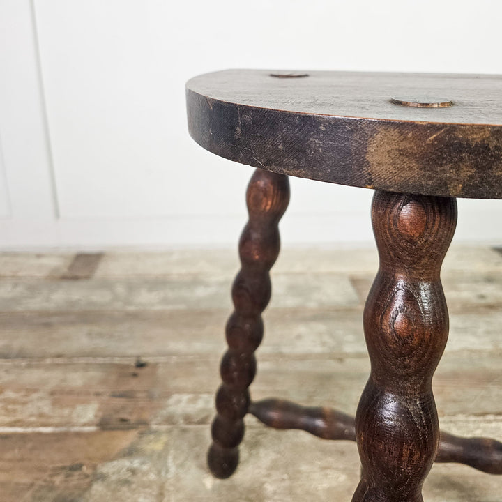 French oak stool with unique bobbin legs.

