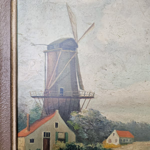 Pastoral European scene highlighting a charming windmill structure.