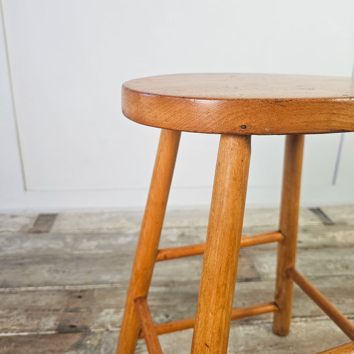 Classic mid-century stool with original patina on elm wood.
