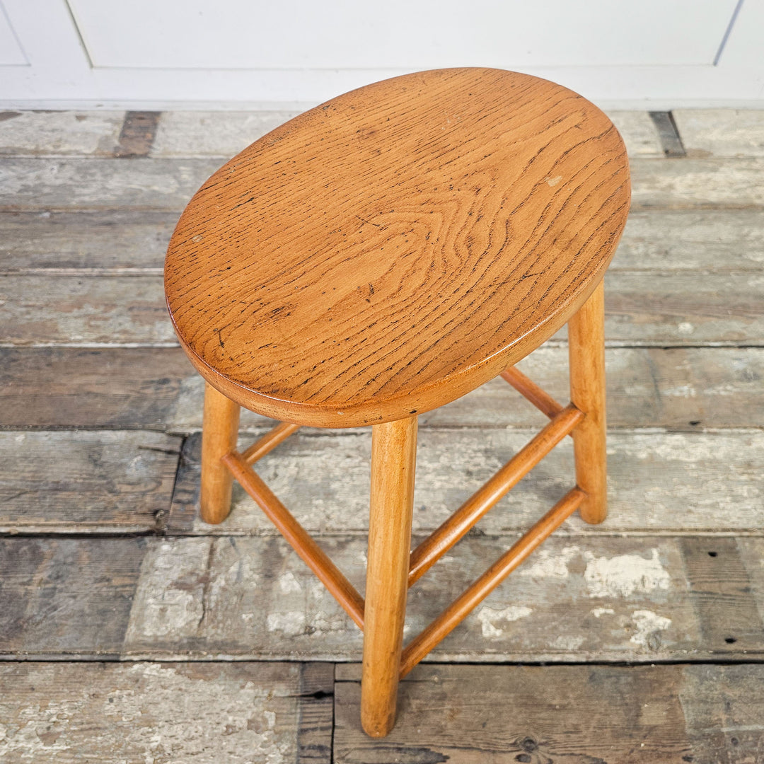 Vintage seating option with elm oval seat and mid-century design.
