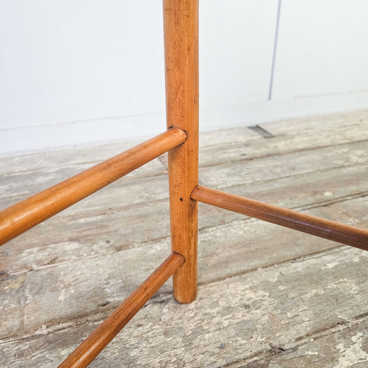 School-style vintage stool in elm with oval seat and straight legs.
