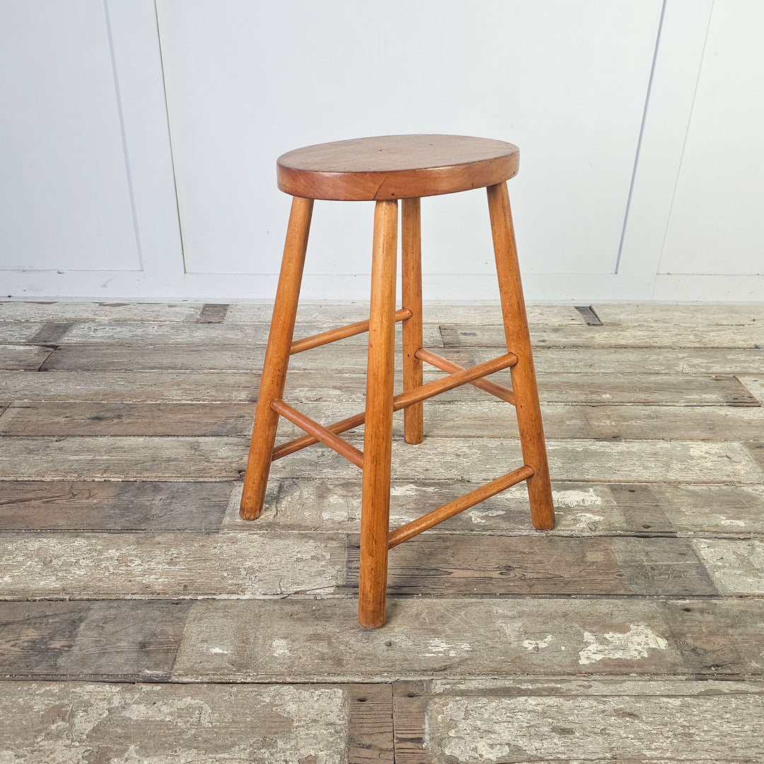 Simple and sturdy elm stool with oval seat, mid-century inspired.
