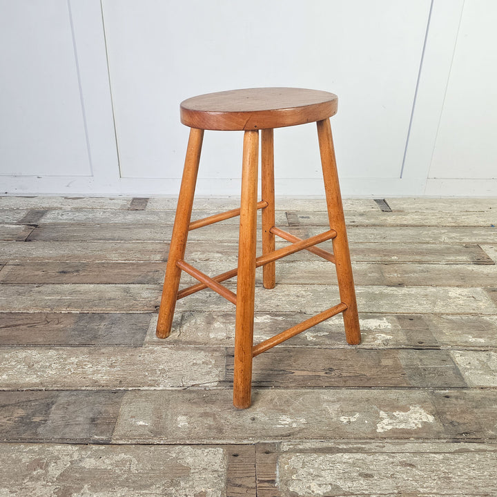 Simple and sturdy elm stool with oval seat, mid-century inspired.

