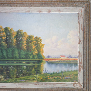 20th century French landscape oil painting on board, signed and presented in a rustic painted wooden frame, depicting a reflective pond with tall trees and surrounding greenery. An original vintage artwork in greens, blues, and earthy tones, adding decorative charm and authenticity to a home interior.