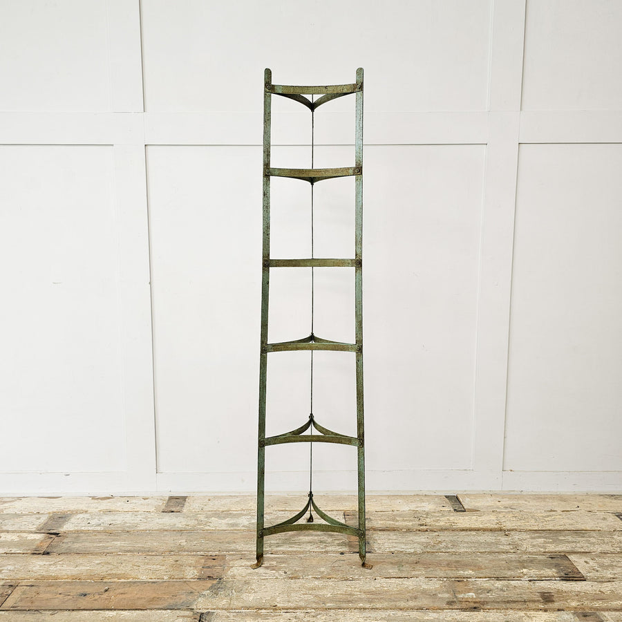 Vintage wrought iron pan stand with blue/green finish, 6 tiers, suitable for cookware or plants.