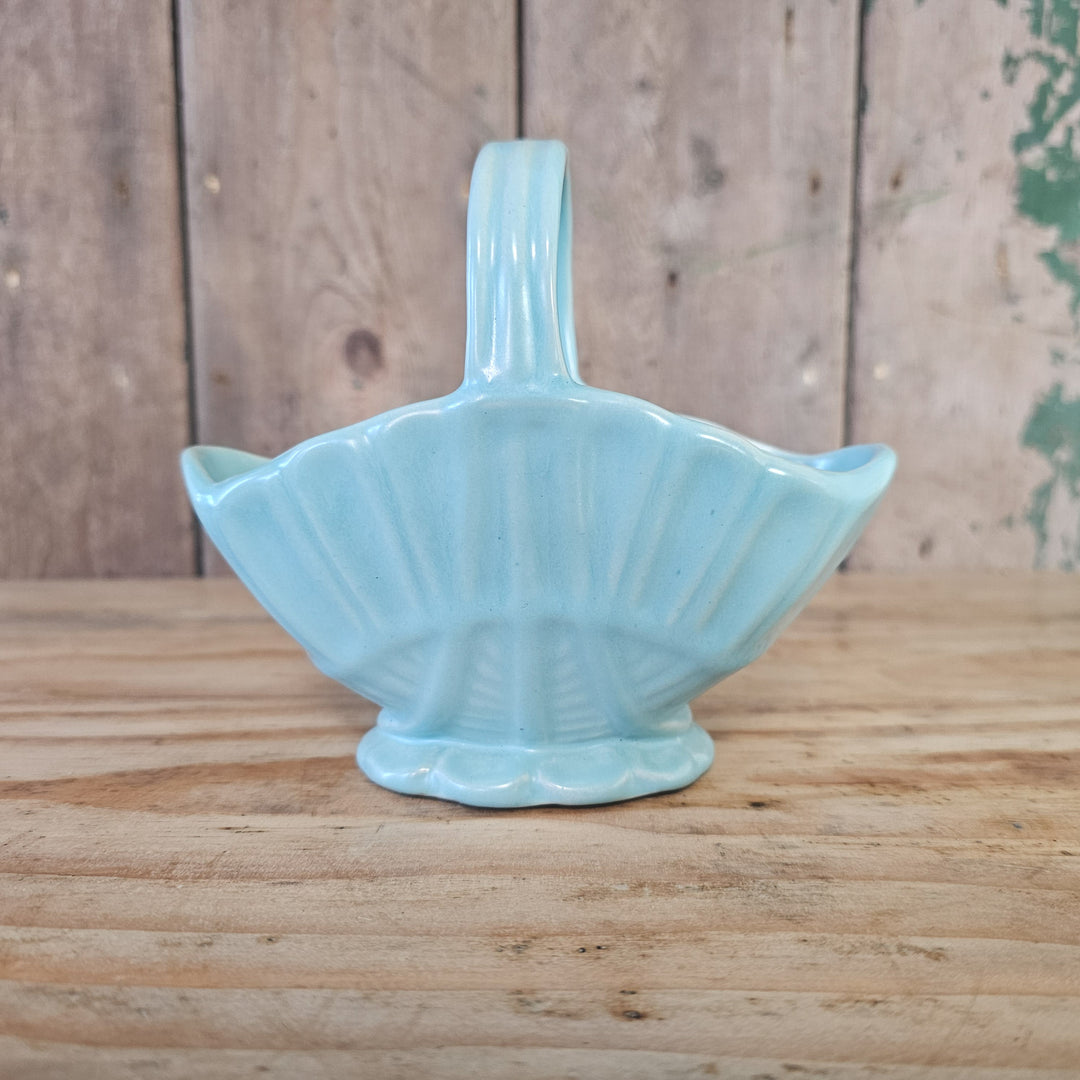Mid century posy basket in soft blue glaze with upright handle