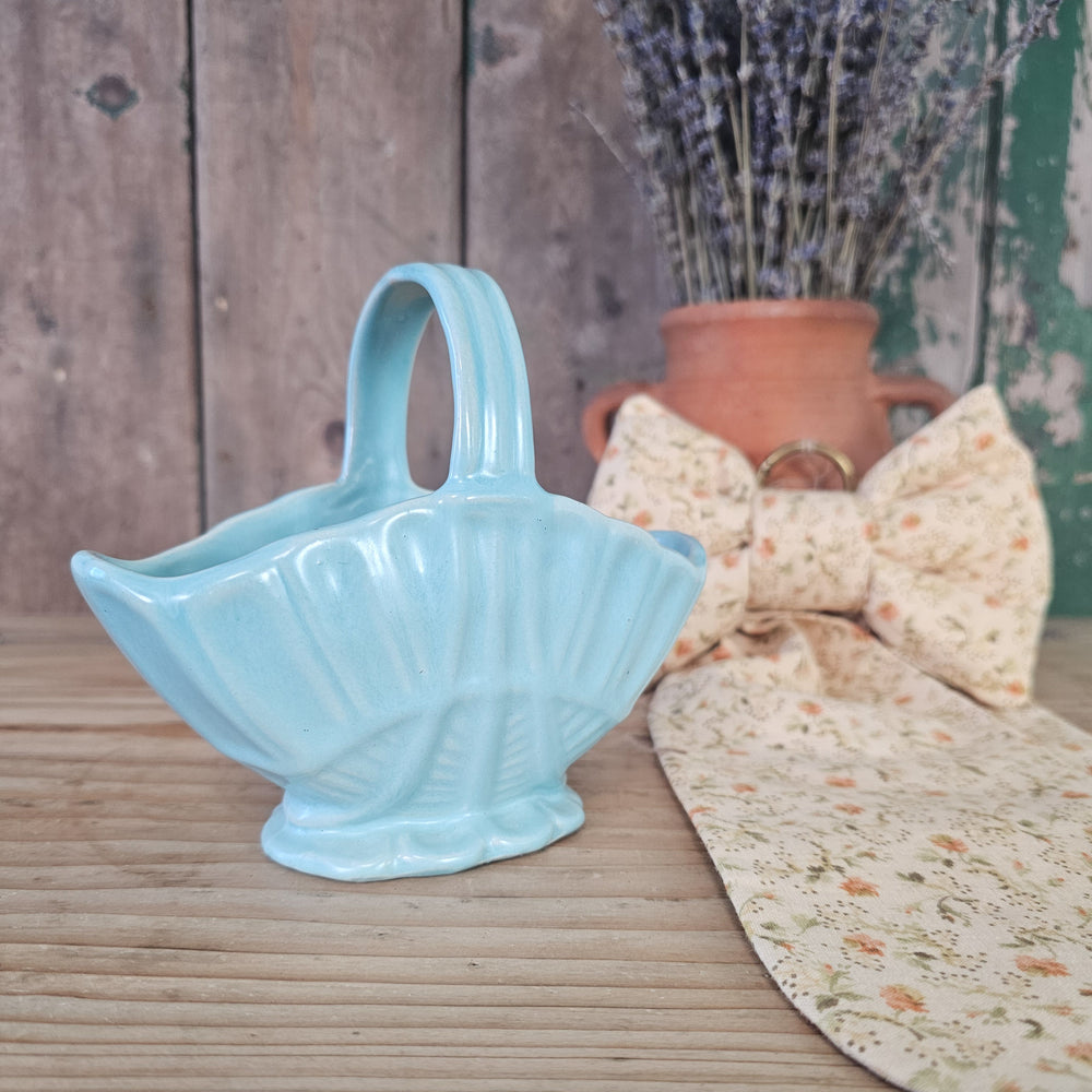 Pastel blue basket vase with fluted body and upright handle