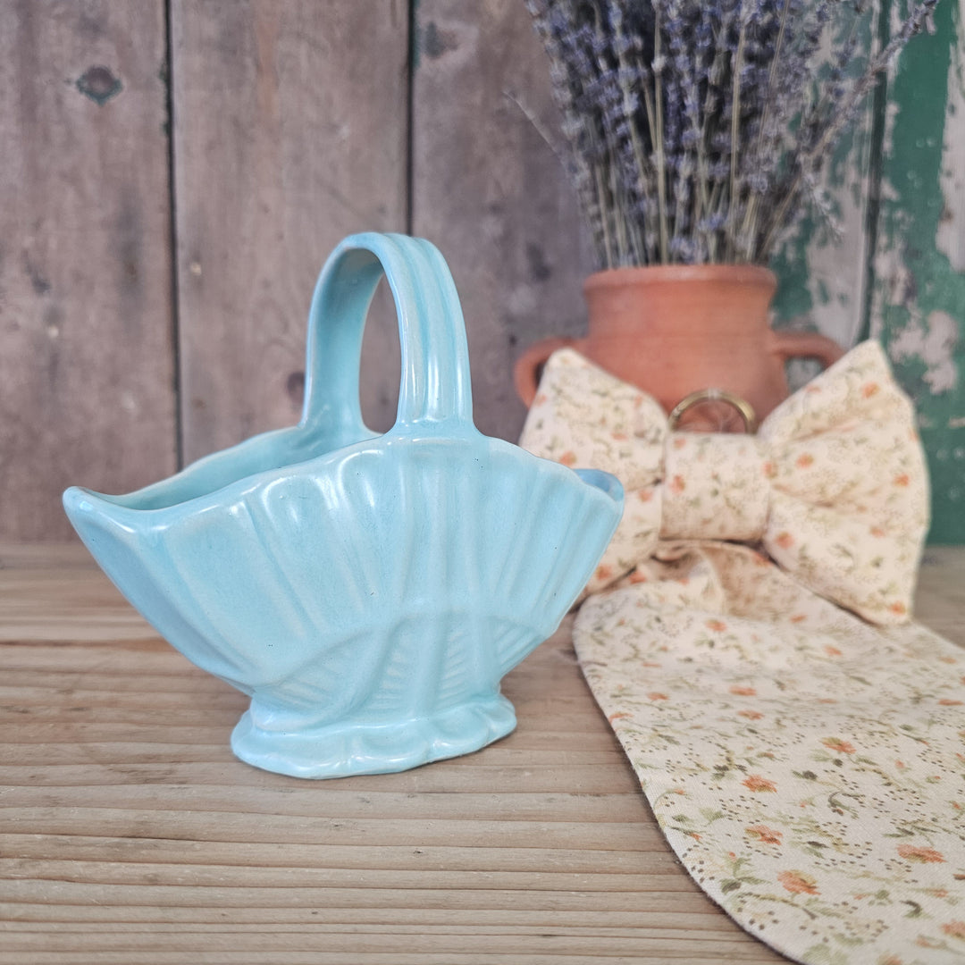 Pastel blue basket vase with fluted body and upright handle