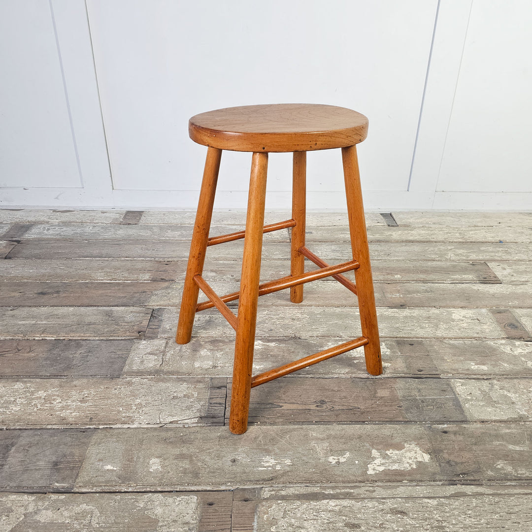 Simple mid-century elm stool, perfect as plant stand or extra seating.
