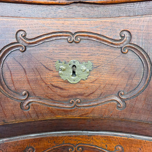 19th century French walnut commode with serpentine drawer fronts, full-width drawer layout, original brass handles and escutcheons, and a shaped apron below.
