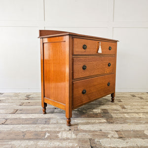 Early 1900s oak chest of drawers by Waring and Gillow