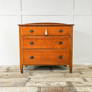 Antique oak chest of drawers by Waring and Gillow, early 20th century