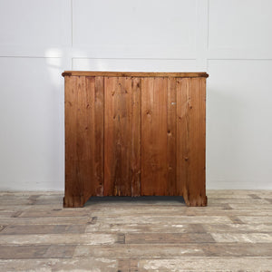 A large Victorian rustic pine chest with a two-over-three layout, decorative wooden knobs and a plinth base. The waxed surface and aged patina create a traditional country house style storage chest suitable for clothes or linens.