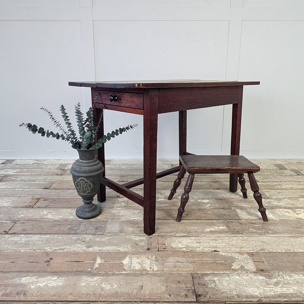  A compact farmhouse style antique table, ideal as a side table, hall table or small kitchen table.
