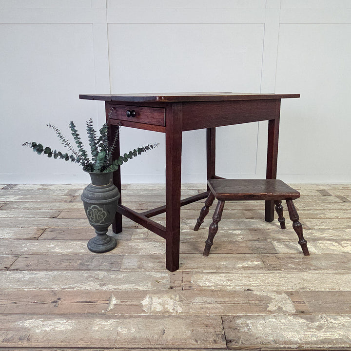  A compact farmhouse style antique table, ideal as a side table, hall table or small kitchen table.
