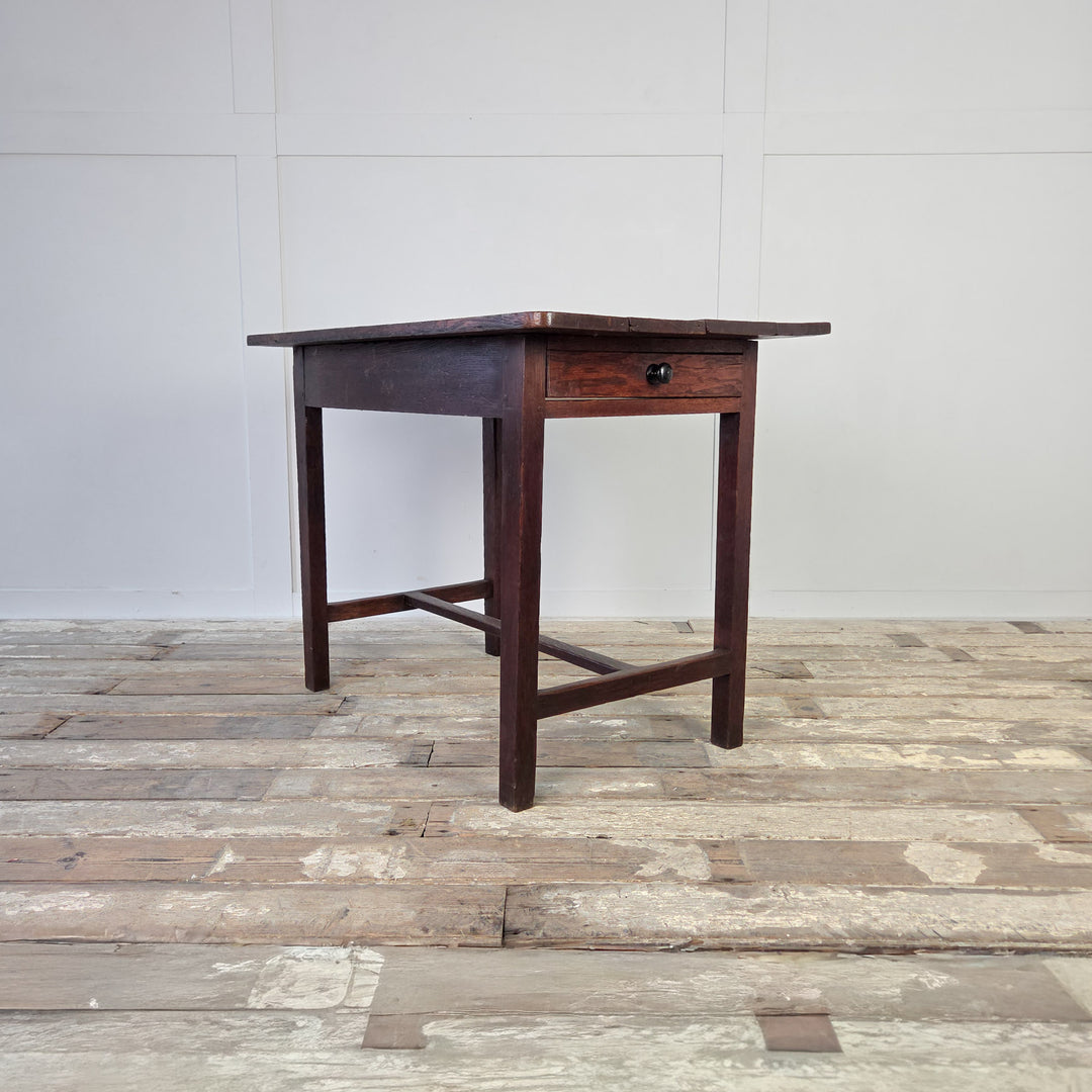 Antique oak farmhouse table, 19th century Welsh dairy table with four planked top and original full-length drawer. Supported on slim legs and a lower stretcher, this rustic antique table suits use as a side table, hall table or small kitchen table.
