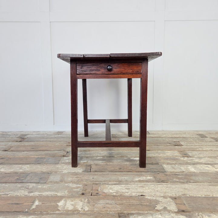 Antique oak dairy table from Wales, 19th century, with rectangular planked top and wide drawer. Raised on slim legs with stretcher. A small farmhouse table ideal for use as a hall table, kitchen table or versatile antique side table.