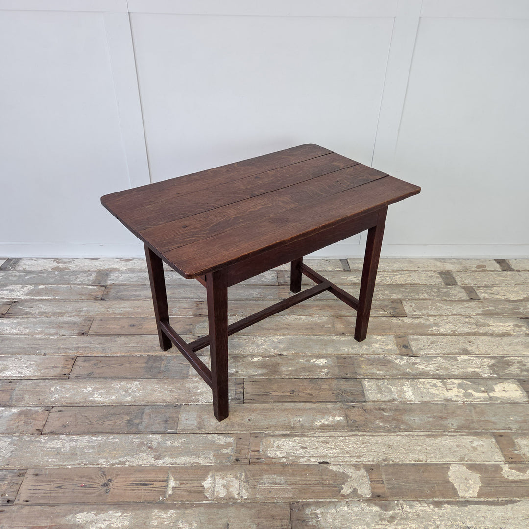 19th century Welsh oak dairy table with four planked top, single drawer to apron and straight legs joined by stretcher. Antique oak farmhouse style table, practical in compact proportions, for use as hall table, side table or small kitchen table.