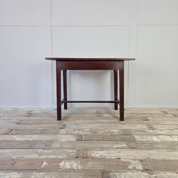 Antique farmhouse table in oak, 19th century Welsh dairy table with four planked top, long drawer, and slim legs with stretcher. Compact antique table that adapts well as a hall table, kitchen table or rustic oak side table.