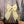Handmade decorative fabric bow by Jennings & Cox, created from vintage yellow patterned fabric. Featuring a padded structure, long tapering tails, and brass hanging ring, each Country House Bow is unique and versatile for styling.