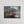 Early 20th century oil on canvas romantic landscape painting with moody atmospheric sky
