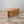 French antique pine trunk with original hand-painted floral garland suspended from blue ribbon bows at each corner
