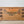 Antique painted pine chest with hand-painted ribbon and bow garland decoration and iron carrying handles on each side