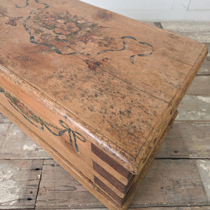 Antique pine blanket box with original hand-painted floral decoration to the front and iron banding to the corners

