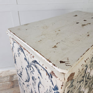 Large antique chest of drawers with freehand Florentine-style blue and white painted design and turned bun feet

