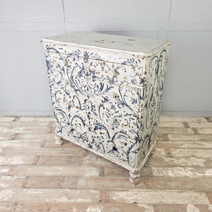 Large antique pine chest of drawers with hand-painted Florentine design, mother of pearl knobs and turned bun feet
