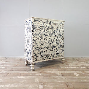Victorian painted pine chest in two over three formation with blue and white foliate Florentine decoration
