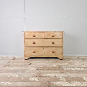 Victorian painted pine four drawer chest with two short drawers over two long raised on bracket style feet
