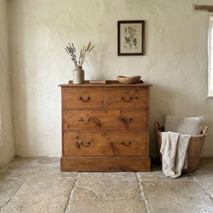 Antique pine chest of drawers with two over two layout, brass swan neck handles and simple plinth base