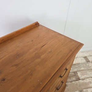 Farmhouse style pine storage drawers with low back upstand, brass swan neck handles and simple plinth base
