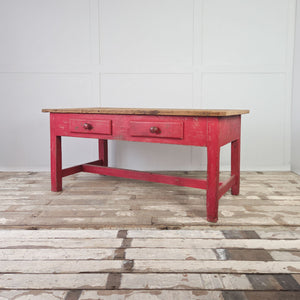 Victorian farmhouse prep table with planked pine top and red-painted base
