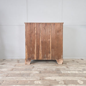 Farmhouse pine two door cupboard with three tiers of interior shelving and shaped bracket feet, waxed finish.