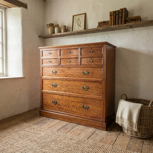 Antique satin birch chest of drawers, early to mid 19th century, eight graduating drawers with brass handles.