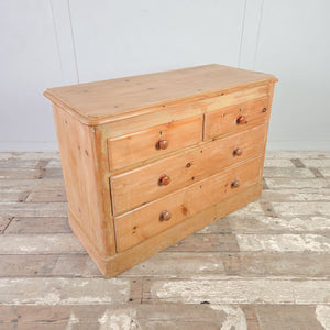 Victorian pine storage drawers with centred keyholes, turned knobs and raised plinth base.


