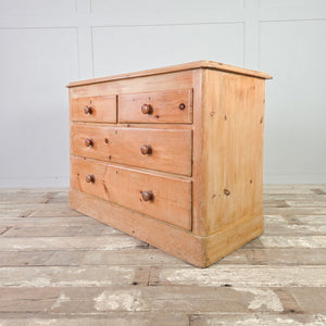 Antique pine chest of drawers with Victorian two over two configuration and centred escutcheons.

