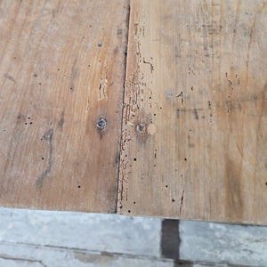 19th Century antique Victorian kitchen table with a sycamore plank top and dark painted base raised on turned legs.
