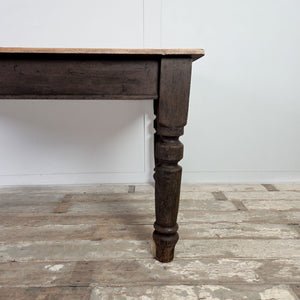 Victorian 19th Century farmhouse dining table in pine with a planked sycamore top, dark painted base and one apron drawer fitted with two glass knobs.
