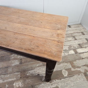 Antique Victorian farmhouse kitchen table with sycamore plank top, dark painted base and chunky turned legs with one drawer.
